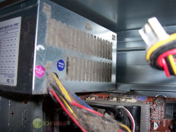 Computer case filled with dust, debris, and pet hair buildup