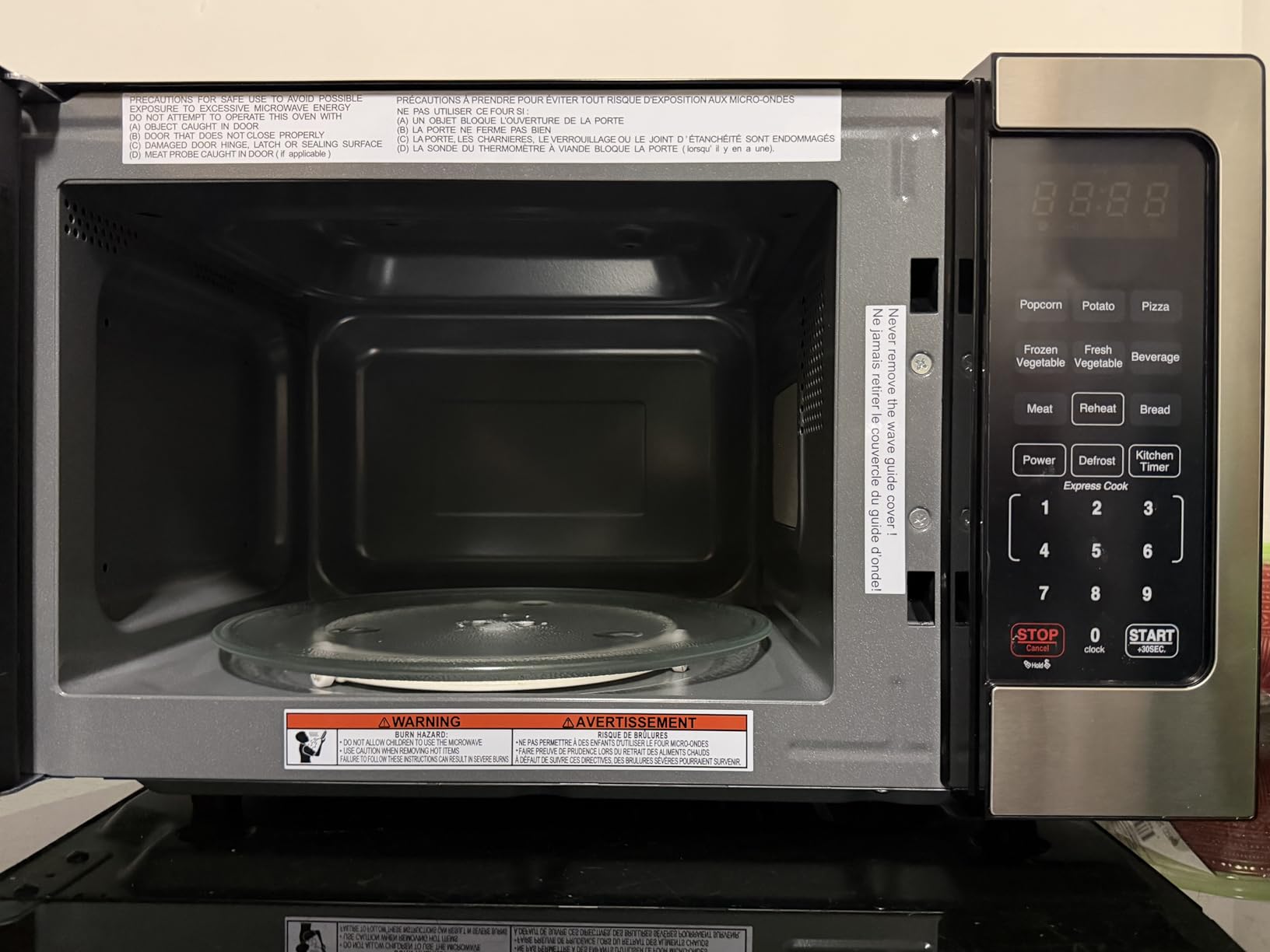 Farberware 0.7 Cu. Ft. Countertop Microwave Oven – 700 Watts Power, Auto Cook Settings, Defrost, Easy Clean and Child Safety Lock - Stainless - Customer Photo 3